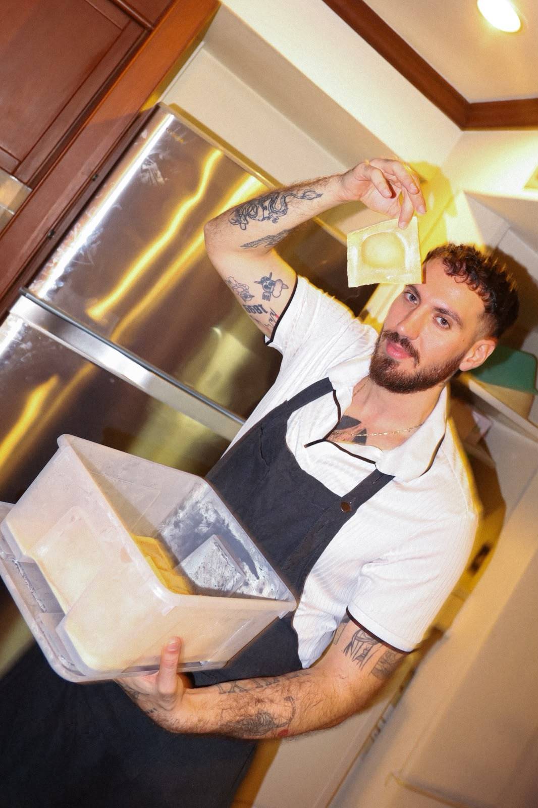 Handmade ravioli held up by chef Giuseppe Costanzo